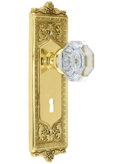 Egg and Dart Style Mortise Lock Set with Waldorf Crystal Door Knobs in Polished Brass.